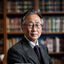数字媒体研究学者林晓峰教授头像，中年男性，气质儒雅，背景为大学研究室书架